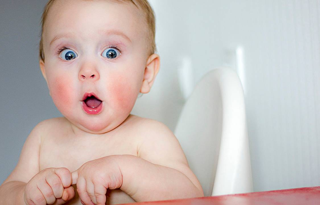 child's eyes widened and mouth opened in amazement. copy space for your text