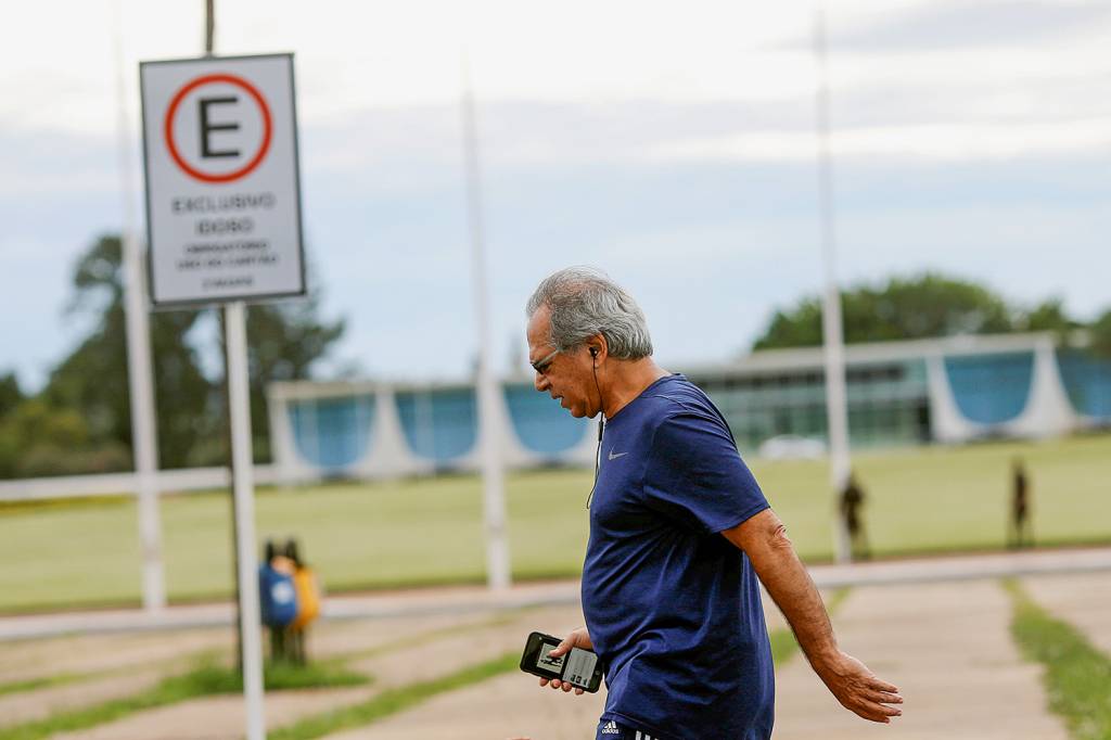 Brazil’s Economy Minister Paulo Guedes walks during a physical exercise near Alvorada Palace in Brasilia Brazil’s Economy Minister Paulo Guedes walks during a physical exercise near Alvorada Palace in Brasilia