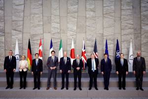 BRUSSELS, BELGIUM - MARCH 24: NATO Secretary General Jens Stoltenberg, European Commission President Ursula von der Leyen, Japan's Prime Minister Fumio Kishida, Canada's Prime Minister Justin Trudeau, U.S. President Joe Biden, Germany's Chancellor Olaf Scholz, British Prime Minister Boris Johnson, France's President Emmanuel Macron, Italy's Prime Minister Mario Draghi and European Council President Charles Michel pose for a G7 leaders' family photo during a NATO summit on Russia's invasion of Ukraine, at the alliance's headquarters in Brussels, on March 24, 2022 in Brussels, Belgium. Heads of State and Government take part in the North Atlantic Council (NAC) Summit. They will discuss the consequences of President Putin's invasion of Ukraine and the role of China in the crisis. Then decide on the next steps to strengthen NATO's deterrence and defence. (Photo by Henry Nicholls - Pool/Getty Images)