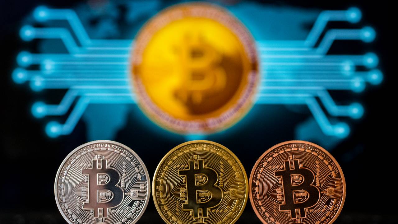 (FILES) In this file photo taken on February 06, 2018 A picture taken on February 6, 2018 shows a visual representation of the digital crypto-currency Bitcoin, at the "Bitcoin Change" shop in the Israeli city of Tel Aviv. - From its birth in an anonymous paper in 2008 to growth into one of the world's most volatile and closely watched financial instruments in 2018, bitcoin has lived through a tumultuous first 10 years. (Photo by JACK GUEZ / AFP)