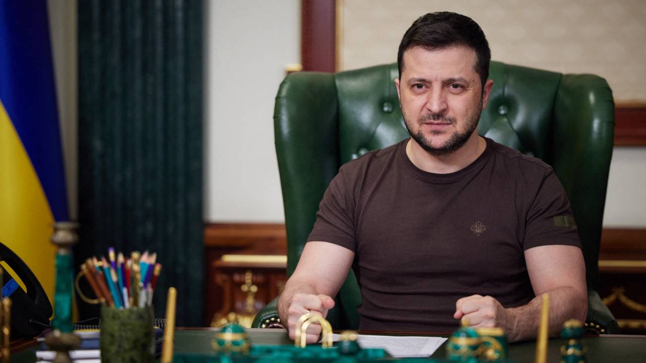 In this handout picture taken and released by the Ukrainian Presidency Press Office early on March 14, 2022, Ukrainian President Volodymyr Zelensky delivers a video address in Kyiv. - Ukrainian President Volodymyr Zelensky on March 14 urged NATO to impose a no-fly zone over his country or see its member states attacked by Russia. (Photo by Handout / UKRAINIAN PRESIDENTIAL PRESS SERVICE / AFP) / RESTRICTED TO EDITORIAL USE - MANDATORY CREDIT "AFP PHOTO / Ukrainian presidential press service " - NO MARKETING - NO ADVERTISING CAMPAIGNS - DISTRIBUTED AS A SERVICE TO CLIENTS