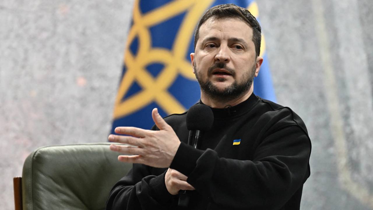 Ukrainian President Volodymyr Zelensky gestures as he gives a press conference in Kyiv on February 24, 2023, on the first anniversary of the Russian invasion of Ukraine. (Photo by Genya SAVILOV / AFP)