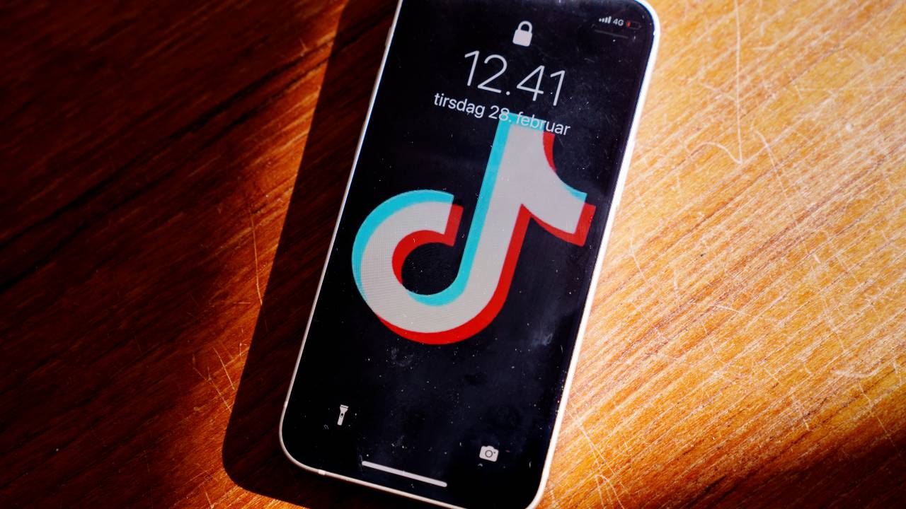 A picture taken on February 28, 2023 in Randers, Denmark shows a smartphone with the TikTok app on the screen. - Denmark's parliament announced February 28, 2023 that it had asked MPs and all staff to remove the TikTok app from mobile devices because of the "risk of spying". It follows recommendations from the Danish Centre for Cyber Security urging officials and civil servants to remove TikTok from their phones, after the European Commission banned the app on work devices to "protect" the institution. (Photo by Bo Amstrup / Ritzau Scanpix / AFP) / Denmark OUT