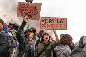 Protesters hold placards expressing their opinions during the demonstration. Thousands of people joined in protest in the Place de la Concorde, in Paris, after the announcement that the Macron government, through Prime Minister Elisaberth Borne, would trigger article 49.3 of the French Constitution that allows the government to force the approval of a bill without passing the National Assembly. Protesters hold placards expressing their opinions during the demonstration. Thousands of people joined in protest in the Place de la Concorde, in Paris, after the announcement that the Macron government, through Prime Minister Elisaberth Borne, would trigger article 49.3 of the French Constitution that allows the government to force the approval of a bill without passing the National Assembly.