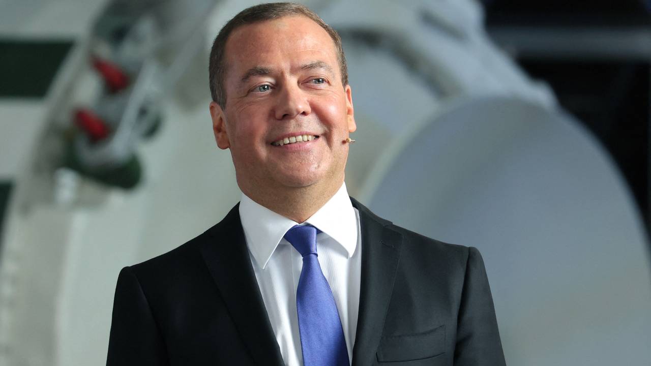 Russia's former leader Dmitry Medvedev, a President Putin ally who is now deputy chairman of the country's security council, meets with staff members during his visit to the military-industrial corporation NPO Mashinostroyenia in Reutov, outside Moscow, on April 25, 2023. (Photo by Yekaterina SHTUKINA / SPUTNIK / AFP)