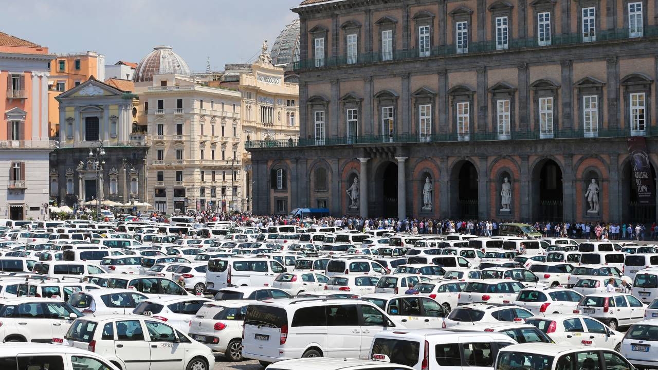 NAPLES, ITALY - 2022/07/12: Over 500 taxis in Plebiscito square in Naples, due to the protest of taxi drivers, against the Italian government, for the deregulation of the sector, and against Uber, the private service for car transport. (Photo by Marco Cantile/LightRocket via Getty Images)
