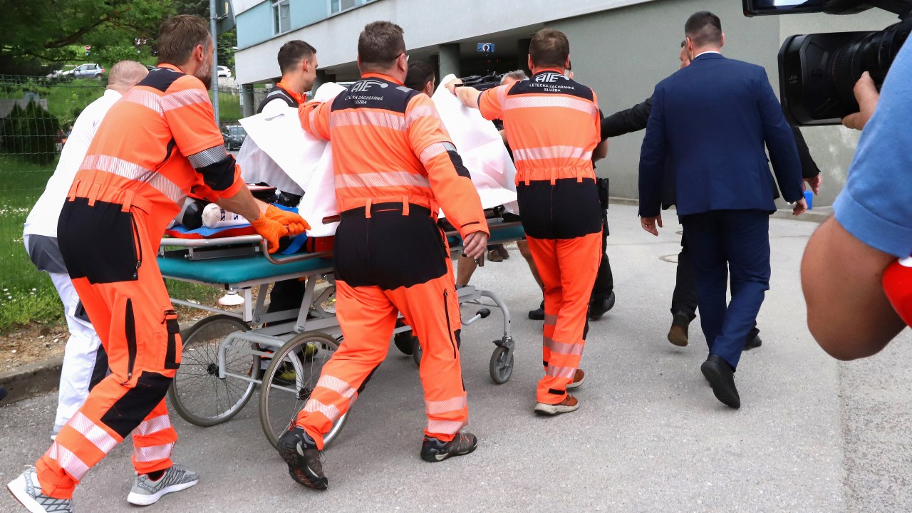 Picture taken on May 15, 2024 shows Slovak Prime Minister Robert Fico being transported by medics and his security detail to the hospital in Banska Bystrica, Slovakia where he is to be treated after he had been shot "multiple times" (Photo by AFP) / ALTERNATIVE CROP