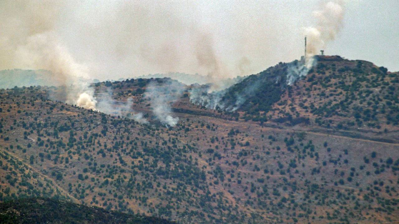 This picture taken from Marjeyoun in southern Lebanon shows smoke billowing across the border following a barrage of rockets on an Israeli outpost near the hills of Kfar Shouba on June 12, 2024 amid ongoing cross-border tensions as fighting continues between Israel and Hamas militants in the Gaza Strip. (Photo by RABIH DAHER / AFP)