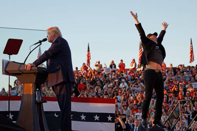 Republican Presidential Nominee Former President Trump Holds Rally In Butler, Pennsylvania BUTLER, PENNSYLVANIA - OCTOBER 05: Elon Musk leaps on stage with Republican presidential nominee, former President Donald Trump during a campaign rally from behind bullet resistant glass at the Butler Farm Show fairgrounds on October 05, 2024 in Butler, Pennsylvania. This is the first time that Trump has returned to Butler since he was injured during an attempted assassination on July 13. (Photo by Anna Moneymaker/Getty Images)
