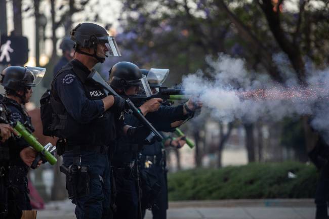 Protests Erupt In L.A. County, Sparked By Federal Immigration Raids LOS ANGELES, CALIFORNIA - JUNE 08: Los Angeles Police Department (LAPD) officers shoot rubber bullets at protesters in front of the City Hall on June 08, 2025 in Los Angeles, California. Tensions in the city remain high after the Trump administration called in the National Guard against the wishes of city leaders following two days of clashes with police during a series of immigration raids. Apu Gomes/Getty Images/AFP (Photo by Apu Gomes / GETTY IMAGES NORTH AMERICA / Getty Images via AFP)