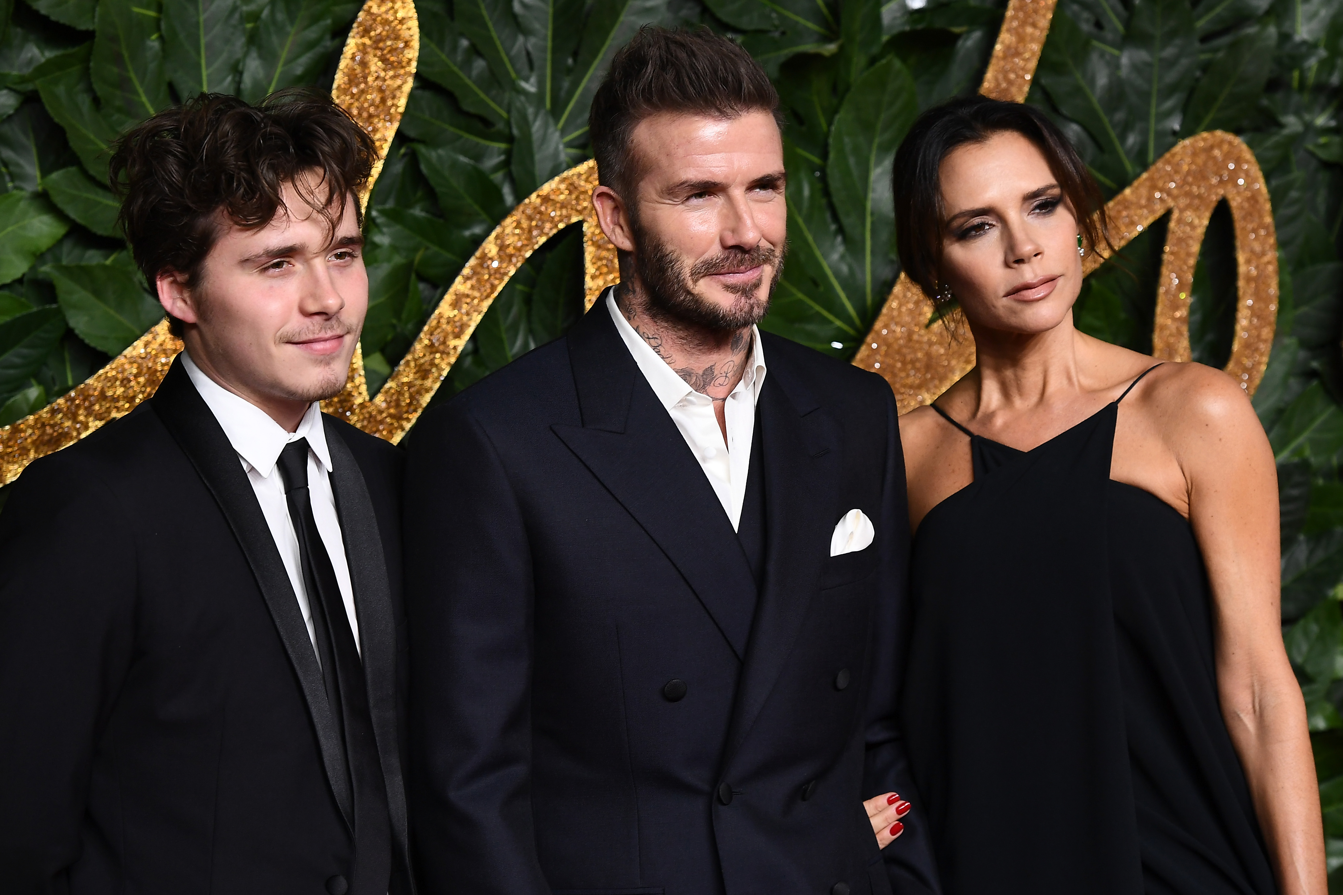 Brooklyn Beckham, David Beckham and Victoria Beckham